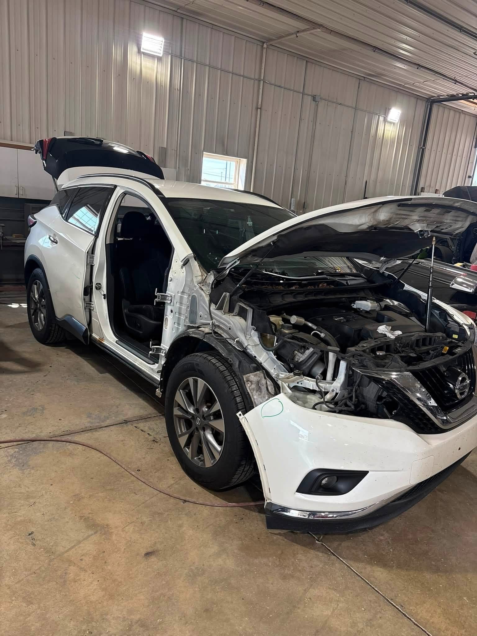 Front-end and side components removed to access damaged areas and complete the repair correctly before reassembly.